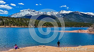 Panorama Snow-capped and forested mountains near a mountain lake, Pikes Peak Mountains in Colorado Spring, Colorado, US Editorial Stock Photo