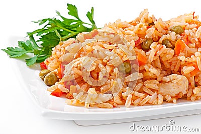 Pilaf with chicken, carrot and green peas Stock Photo
