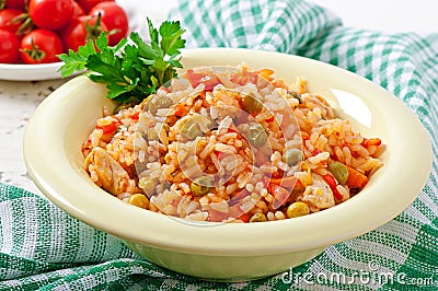 Pilaf with chicken, carrot and green peas Stock Photo