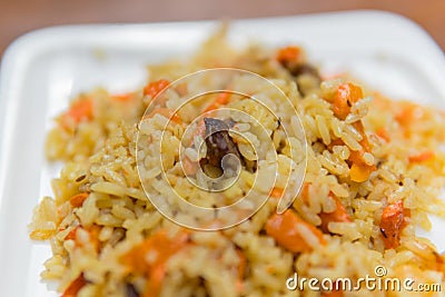 Pilaf of rice with beaf close-up on the plate Stock Photo