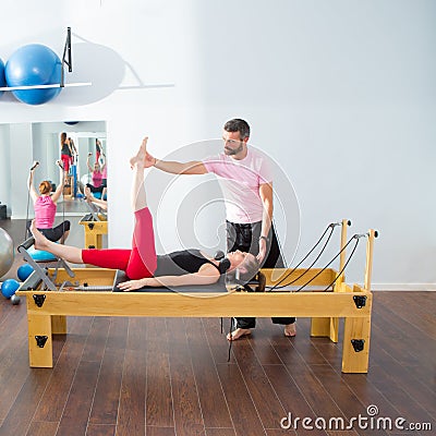 Pilates aerobic personal trainer man in cadillac Stock Photo