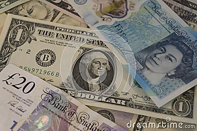 Pile of American and British currency Editorial Stock Photo