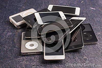 Stack of old iPhones and iPods Editorial Stock Photo