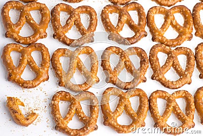 A pile baked pretzels on white. Stock Photo