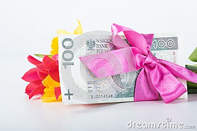 A pile of banknotes related ribbon on gift. Stock Photo