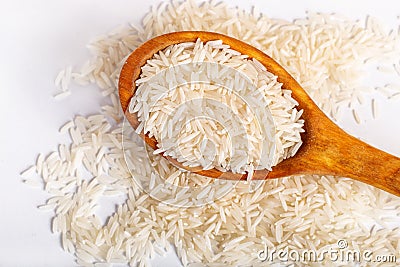 Pile of basmati rice in a wooden spoon. Stock Photo
