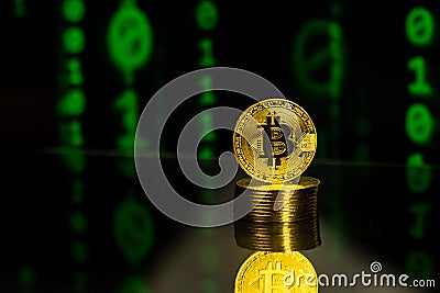 Pile of bitcoins with binary code blockchain background Editorial Stock Photo