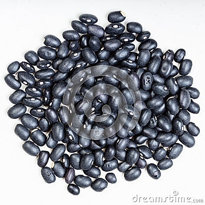 Pile of black mexico beans close up on gray plate Stock Photo