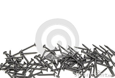 A pile of black screws with copy space. Isolated on white Stock Photo