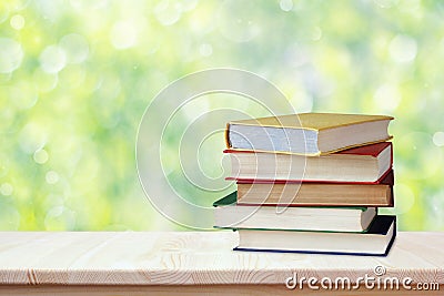 Pile of books in color covers. Workplace of the student. Back to school. Education, study, science Stock Photo