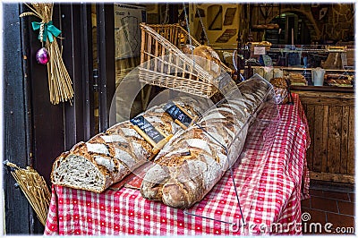 Pile of bread in the bakery in small town Ribeauville, Alsace, France Editorial Stock Photo