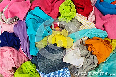 Pile of carelessly scattered clothes. Stock Photo