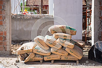 Pile of Cement in bags for construction at construction site Editorial Stock Photo