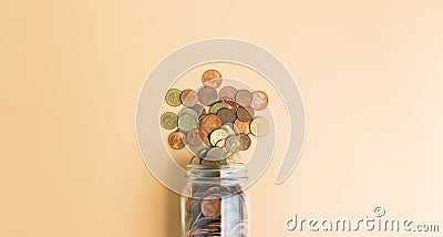 Pile coins in the bottle, Money growing concept and the goal success. Stock Photo