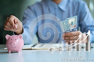 Pile of coins and piggy bank ideas to grow Savings and Investments in Business Double graph display, stock display and coin organi Stock Photo