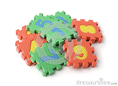 Pile of colorful foam math numbers puzzle pieces Stock Photo