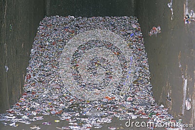 A pile of compacted aluminum cans in a cement compacter in Santa Monica, California Editorial Stock Photo