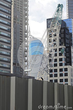 Pile construction crane in site around high rise glass building in Jakarta Indonesia Editorial Stock Photo