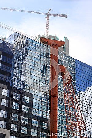 Pile construction crane in site around high rise glass building in Jakarta Indonesia Editorial Stock Photo