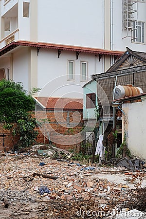 Pile of construction waste, a dilapidated house, a city dump Editorial Stock Photo