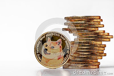 A pile of Dogecoin that has a gold color that is currently popular and has an increasing value compared to the US Dollar. Editorial Stock Photo