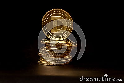 A pile of Dogecoin that has a gold colour that is currently popular and has an increasing value compared to the US Dollar Editorial Stock Photo