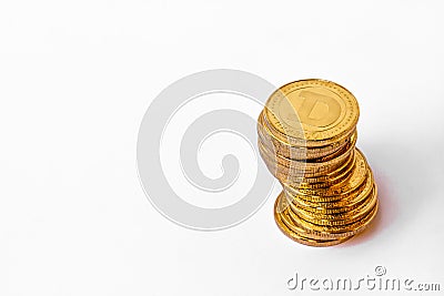 A pile of Dogecoin that has a gold colour that is currently popular and has an increasing value compared to the US Dollar Editorial Stock Photo