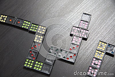 Pile of Dominoes on the table Stock Photo