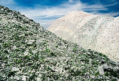 Pile of ecycle pieces of broken glass under blue sky Stock Photo