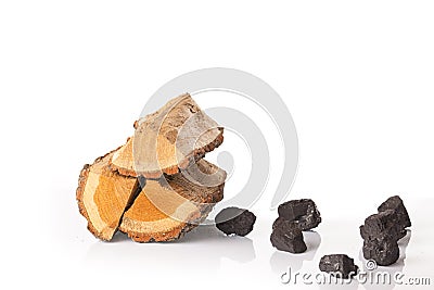 Pile of firewood and pieces of coal Stock Photo