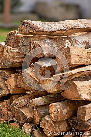 Pile of firewood stacked neatly. fire wood preparation for winter and use for cooking Stock Photo