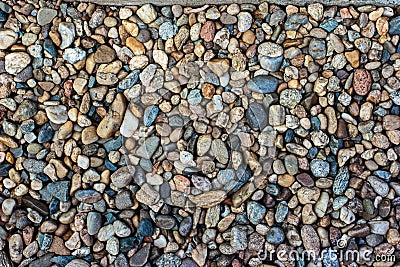 Pile of flat small colored mosaic of pebbles top view Stock Photo