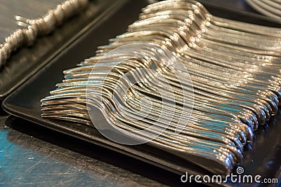 Pile of fork on a tray prepare for event or party Stock Photo