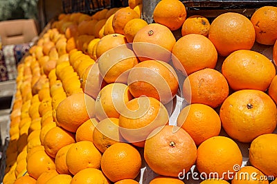 Pile of fresh natural organic orange fruit background in orange color and marked skin texture selling in fruit juice shop Stock Photo