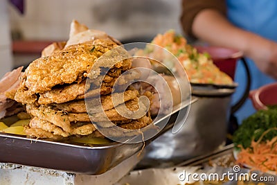 Pile of fried milanesas in a market of Bolivia Stock Photo