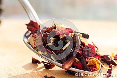 Pile of fruit tea with petals and dry fruit .The composition of the heap of tea leaves and dried hibiscus flower. Stock Photo