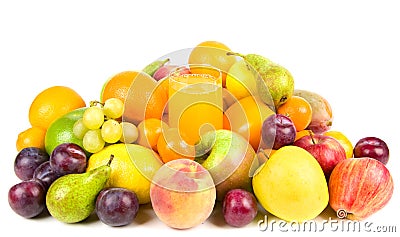 Pile of fruits around a glass of juice Stock Photo