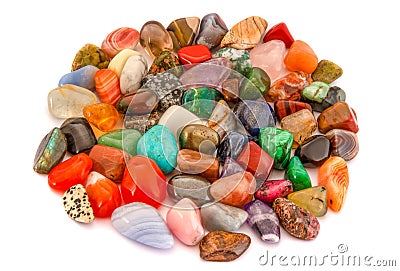 Pile of gemstones on white background. High-angle view. Polished colorful gemstones. Stock Photo