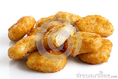 Pile of golden deep-fried battered chicken nuggets isolated on w Stock Photo