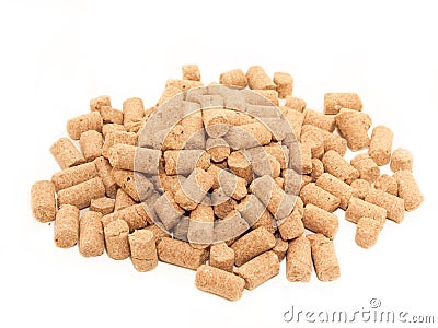 Pile of granules Wheat Bran background. Food for horses and far Stock Photo