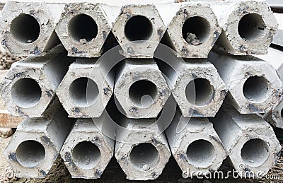 Pile of hexagon concrete foundation piles. Stock Photo