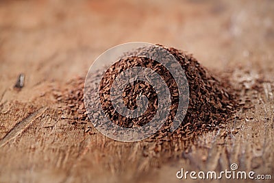 Pile of hot chocolate flakes on wooden background Stock Photo