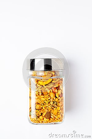 Indian spicy snacks Namkeen - All in one in glass jar with closed lid, made with fried peanut, c Stock Photo