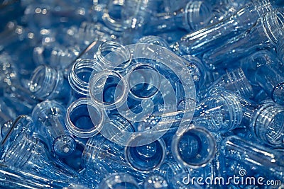 The pile of injection preform shape of PET bottles. Stock Photo