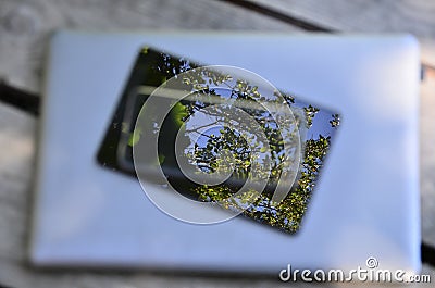 pile of laptop computer and digital tablet electronic devices - unfocused reflection Stock Photo