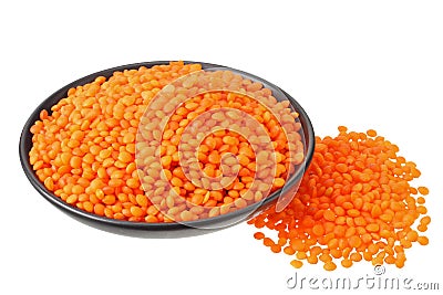 Pile lentil in black bowl isolated on white background Stock Photo