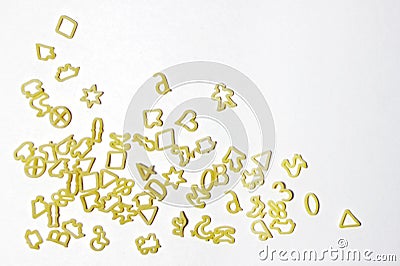 A pile of letters and shapes in the form of pasta, pasta on a light background, space for text Stock Photo