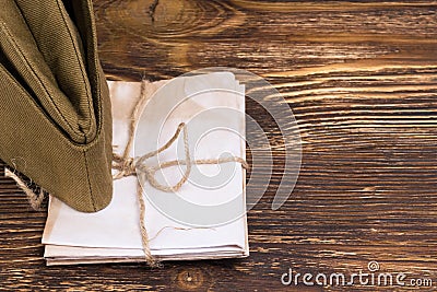 The pile of letters under the old military cap , place the graphic on the right Stock Photo