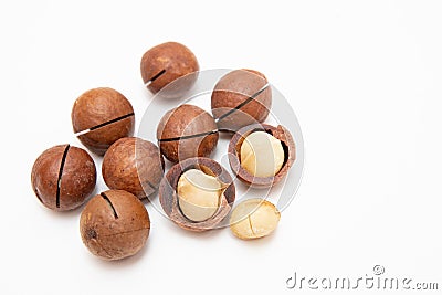 Pile macadamia nuts open kernels and shells on white background, top view Stock Photo