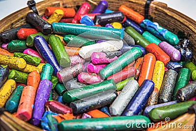 Pile of many color Crayons In the basket. Stock Photo